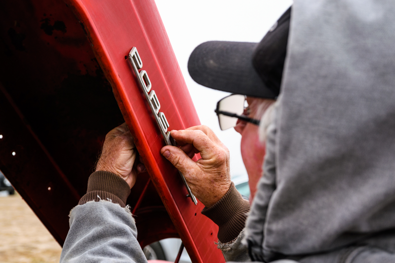 Vital repairs at the Long family’s campsite: the bigger tractor needs a badge!